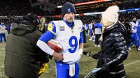 Los Angeles Rams quarterback Matthew Stafford (9) holds a game ball as he is interviewed by NBC sideline reporter Melissa Stark after a NFC Divisional Round game against the Chicago Bears at Soldier Field.