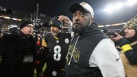 Pittsburgh Steelers head coach Mike Tomlin and quarterback Aaron Rodgers (8) celebrate after defeating the Baltimore Ravens at Acrisure Stadium.