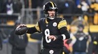 Pittsburgh Steelers quarterback Aaron Rodgers (8) drops back to pass against the Baltimore Ravens during the first half at Acrisure Stadium