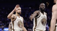 Golden State Warriors guard Stephen Curry (30) and forward Draymond Green (23) high five guard Brandin Podziemski (2) after a play against the Sacramento Kings during the fourth quarter at Chase Center. Mandatory Credit: Kelley L Cox-Imagn Images