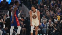 Golden State Warriors guard Stephen Curry (30) reacts after making a three point basket next to Detroit Pistons center Jalen Duren (0) in the first quarter at the Chase Center.