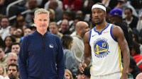 Golden State Warriors head coach Steve Kerr and forward Jimmy Butler (10) looks on during a timeout in the second quarter against the Milwaukee Bucks at Fiserv Forum.