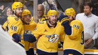 Nashville Predators center Steven Stamkos (91) celebrates with teammates after scoring a goal and a hat trick against the Ottawa Senators during the third period at Bridgestone Arena.