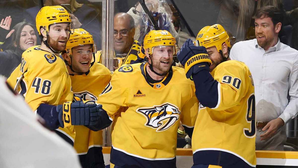 Nashville Predators center Steven Stamkos (91) celebrates with teammates after scoring a goal and a hat trick against the Ottawa Senators during the third period at Bridgestone Arena.