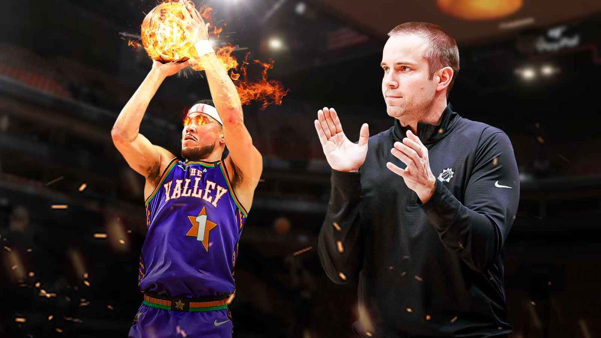 Devin Booker in a Phoenix Suns jersey shooting a basketball that is on fire, and fire coming out of Booker's eyes. Also, Suns head coach Jordan Ott is smiling next to Booker, and there's a background of the Suns home arena.