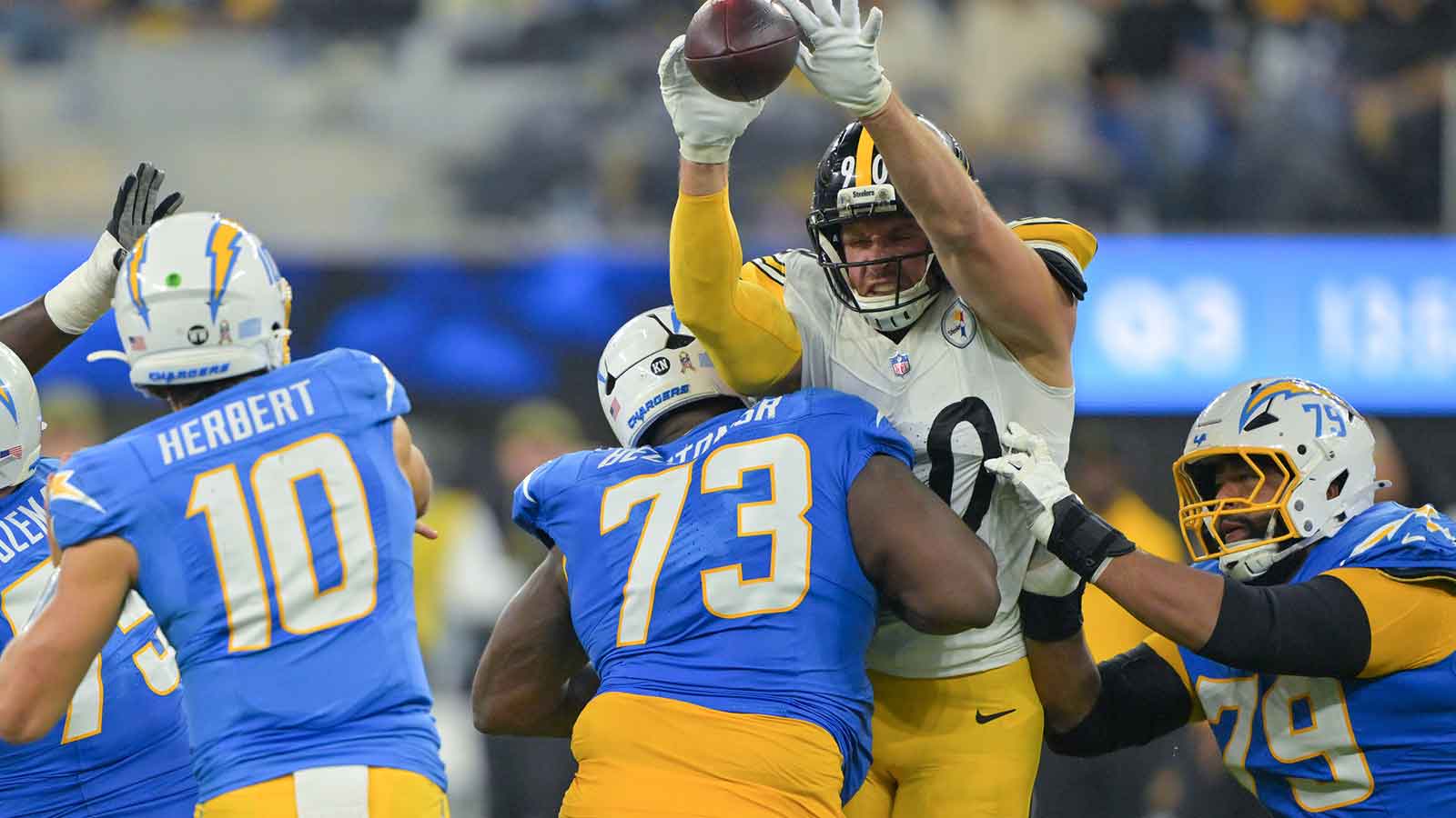 Pittsburgh Steelers linebacker T.J. Watt (90) blocks a pass by Los Angeles Chargers quarterback Justin Herbert (10) during the third quarter of the game at SoFi Stadium.