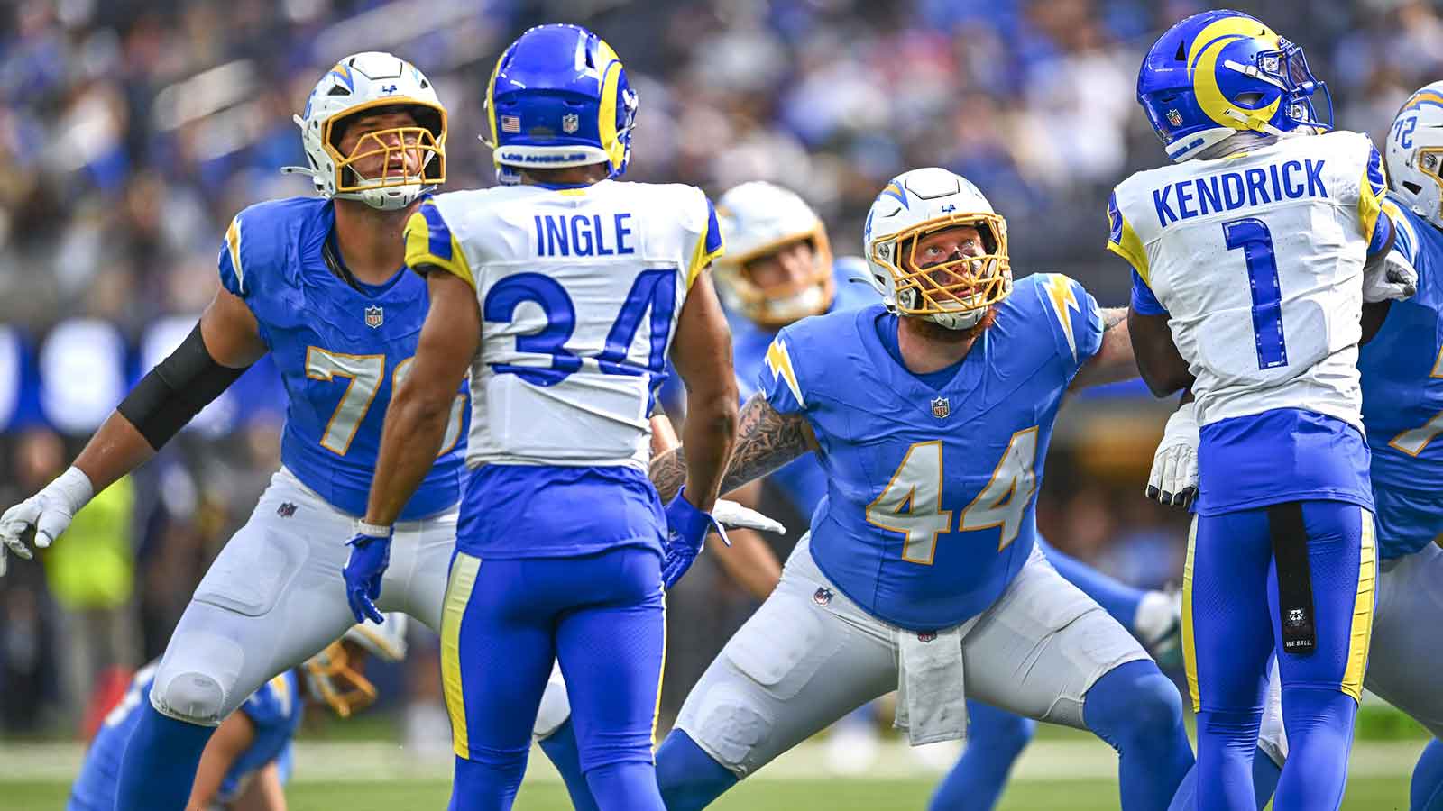 Los Angeles Chargers fullback Scott Matlock (44) and offensive tackle Joe Alt (76) watch a field goal kick against Los Angeles Rams safety Tanner Ingle (34) and cornerback Derion Kendrick (1) during the first quarter at SoFi Stadium.