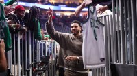 Boston Celtics forward Jayson Tatum (0) celebrates with fans after a victory over the Atlanta Hawks at State Farm Arena