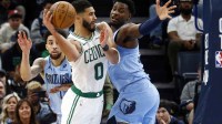 Boston Celtics forward Jayson Tatum (0) passes the ball as Memphis Grizzlies forward Jaren Jackson Jr. (13) defends during the fourth quarter at FedExForum.