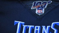 View of an NFL 100 logo on a player jersey during the second half of a game between the Tennessee Titans game and the New England Patriots at Nissan Stadium.