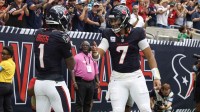 Houston Texans quarterback C.J. Stroud (7) celebrates with wide receiver Stefon Diggs (1) following a first quarter touchdown against the Jacksonville Jaguars at NRG Stadium.