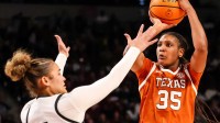 Jan 15, 2026; Columbia, South Carolina, USA; Texas Longhorns forward Madison Booker (35) shoots over South Carolina Gamecocks guard Tessa Johnson (5) in the second half at Colonial Life Arena. Mandatory Credit: Jeff Blake-Imagn Images