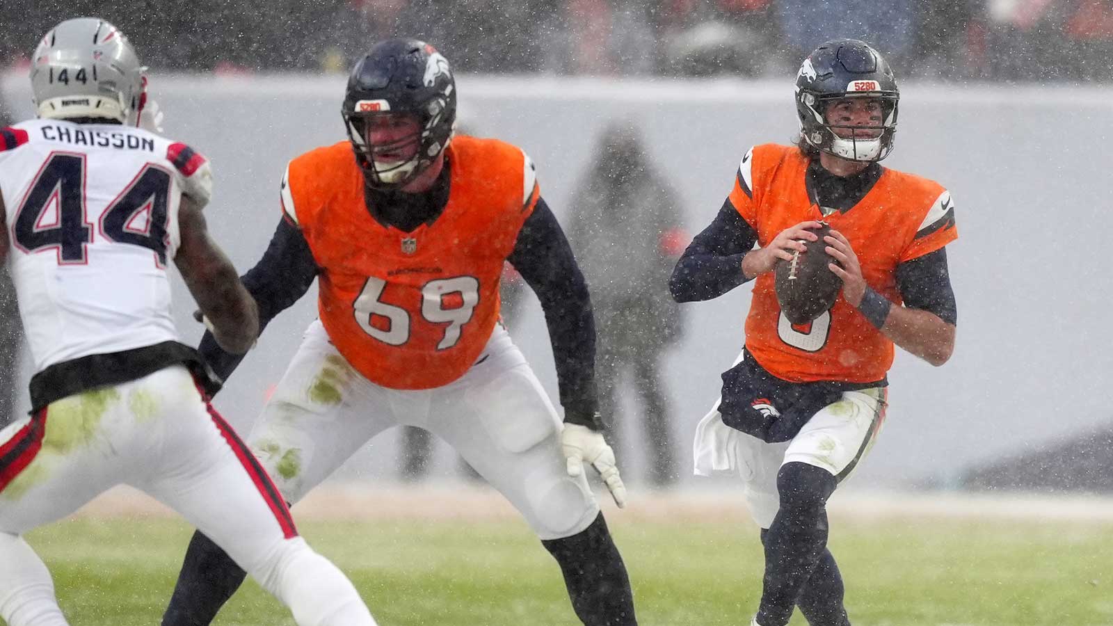 Denver Broncos quarterback Jarrett Stidham (8) drops back to pass against the New England Patriots during the second half in the 2026 AFC Championship Game at Empower Field at Mile High.