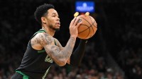 Boston Celtics guard Anfernee Simons (4) attempts a shot against the San Antonio Spurs during the second half at the TD Garden.