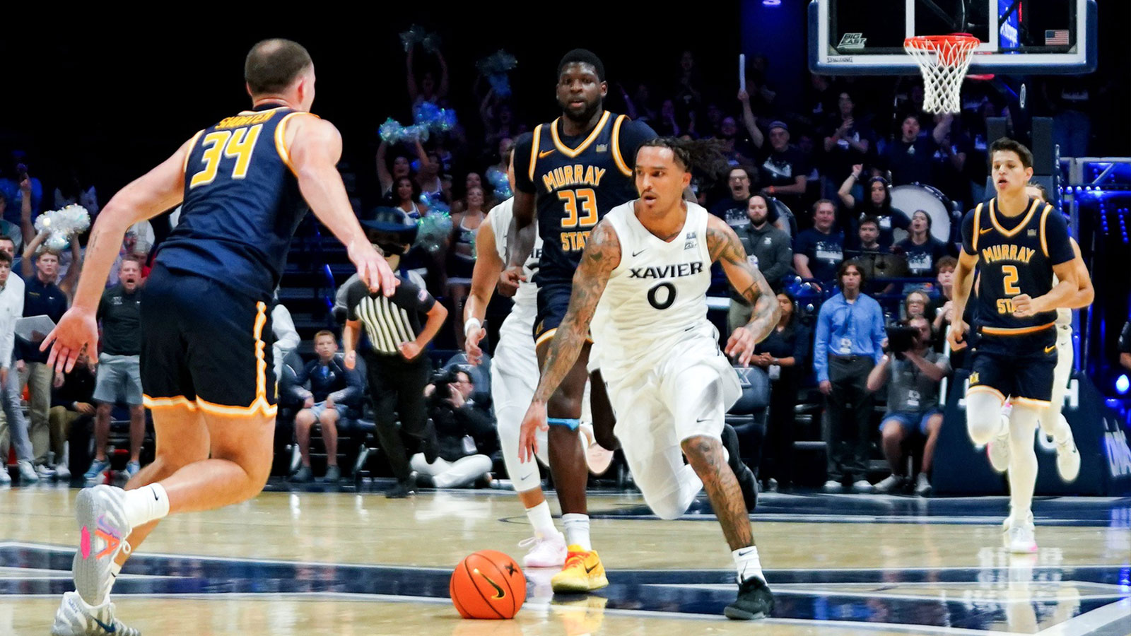 Xavier Musketeers guard Roddie Anderson III (0) drives the ball down the court in the second half of a NCAA men’s basketball game between the Xavier Musketeers and Murray State Racers, Saturday, Oct. 18, 2025, at Cintas Center in Cincinnati. Racers won 75-70.