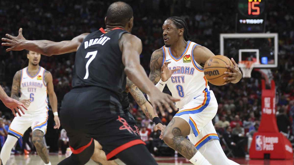 Thunder guard Jalen Williams (8) dribbles the ball as Houston Rockets forward Kevin Durant (7) defends during the third quarter at Toyota Center