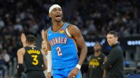 Thunder guard Shai Gilgeous-Alexander (2) reacts after making a three point basket against the Golden State Warriors during the third quarter at Chase Center with the Thunder's 30 wins in the background