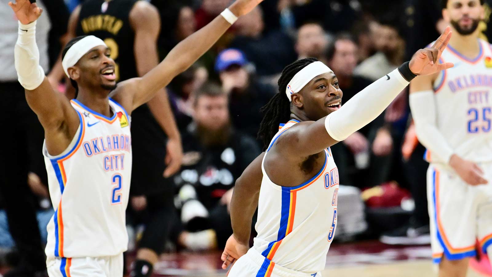 Thunder guard Lu Dort (5) and center Chet Holmgren (7) celebrate after a three point basket during the second half against the Cleveland Cavaliers at Rocket Arena