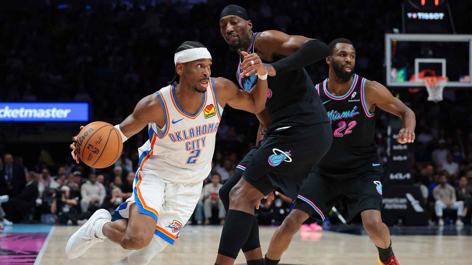 Thunder guard Shai Gilgeous-Alexander (2) drives to the basket against Miami Heat center Bam Adebayo (13) during the second quarter at Kaseya Center