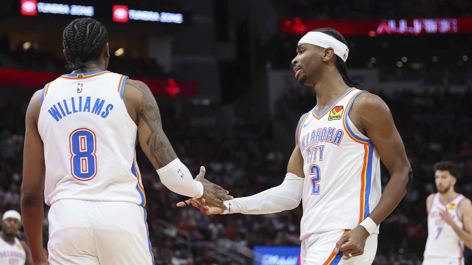 Thunder guard Jalen Williams (8) and guard Shai Gilgeous-Alexander (2) react after a play during the third quarter against the Houston Rockets at Toyota Center