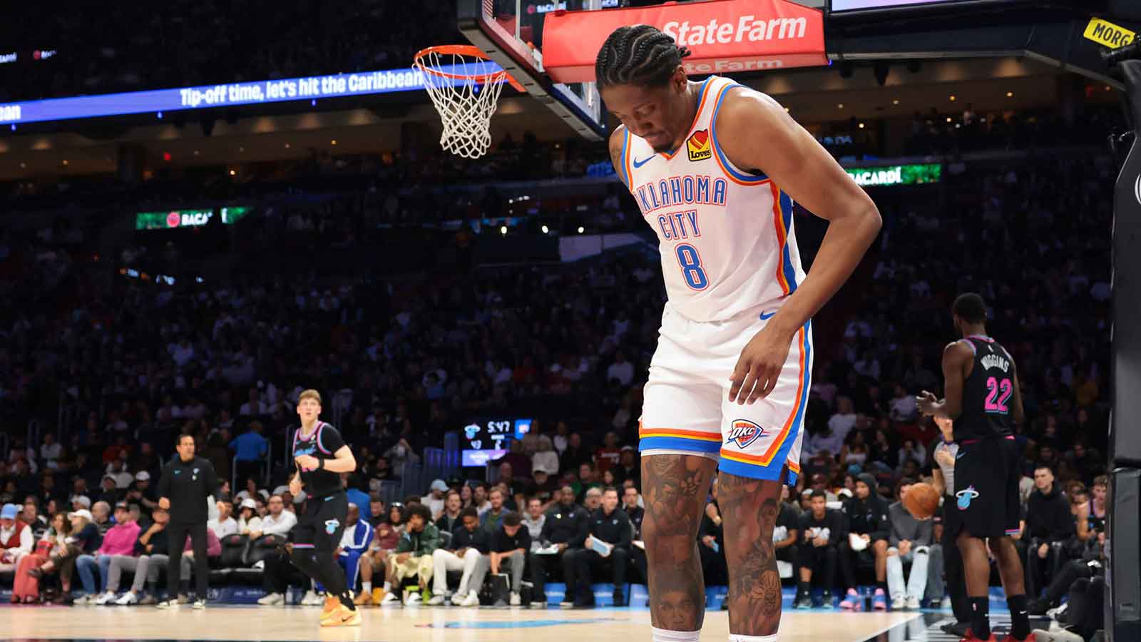 Thunder guard Jalen Williams (8) grabs the back of his right leg after a play against the Miami Heat during the second quarter at Kaseya Center