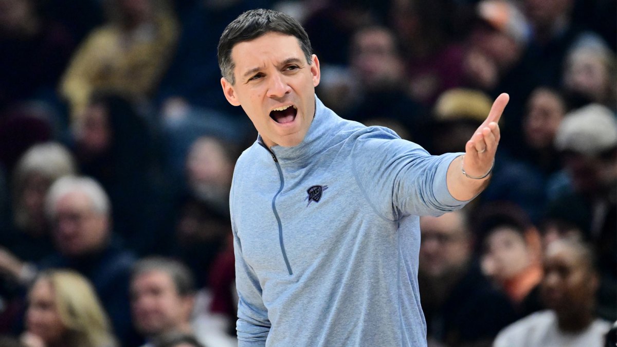 Thunder head coach Mark Daigneault reacts against the Cleveland Cavaliers during the first half at Rocket Arena with the Cavs logo in the backgroud