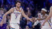Thunder center/forward Chet Holmgren (7) and Oklahoma City Thunder guard Shai Gilgeous-Alexander (2) celebrate after a basket during overtime against the Utah Jazz at Paycom Center