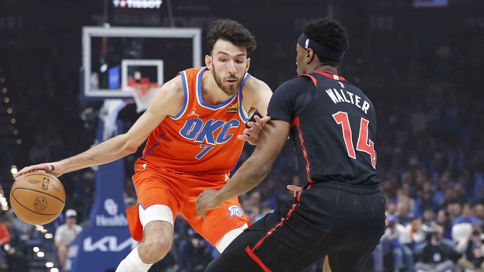 Thunder center/forward Chet Holmgren (7) moves the ball down the court as Toronto Raptors guard Ja'kobe Walter (14) defends during the first quarter at Paycom Center