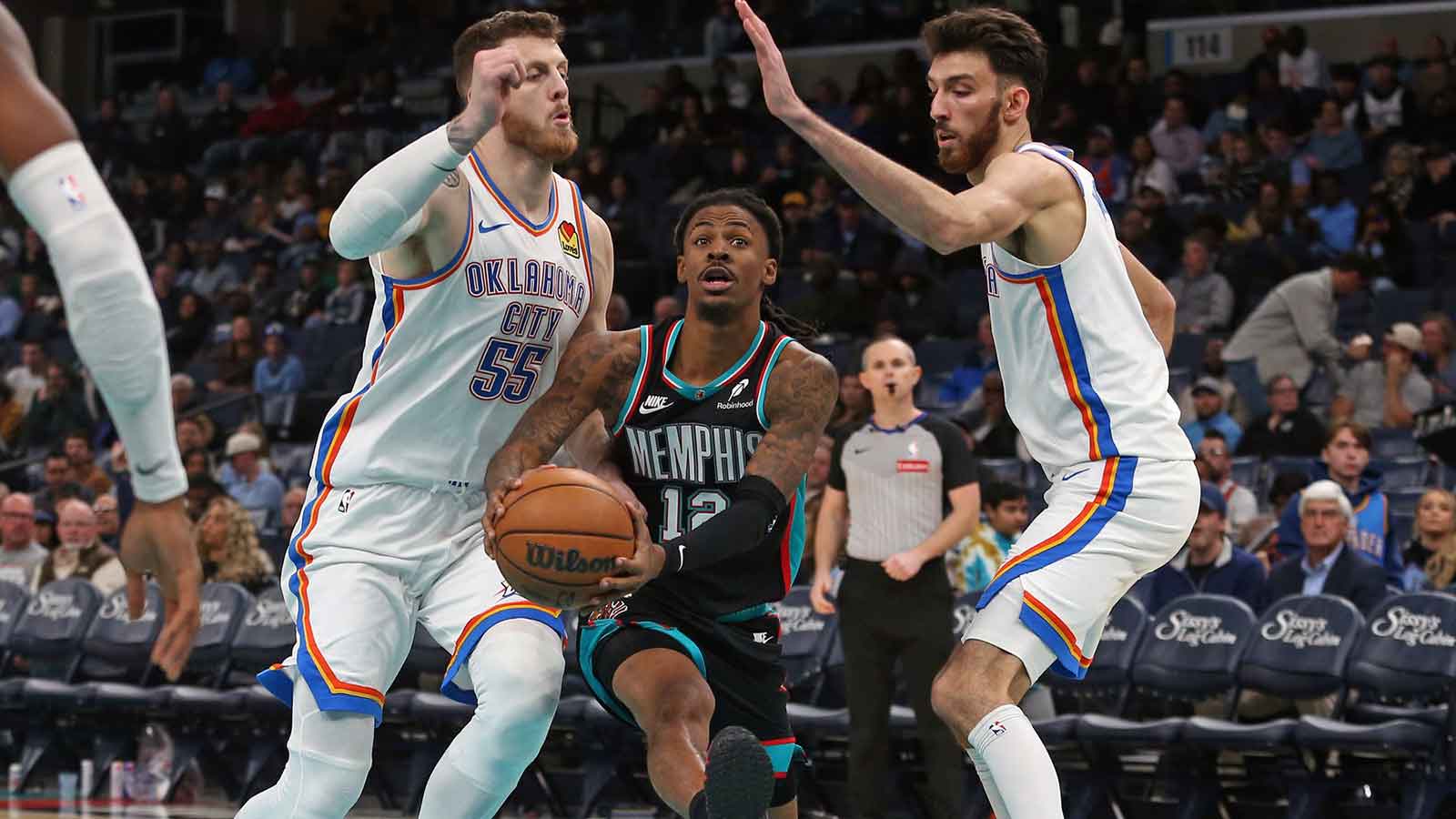 Thunder center Isaiah Hartenstein (55) and center Chet Holmgren (7) during the third quarter at FedExForum