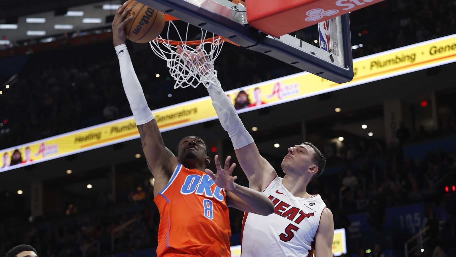 Thunder guard/forward Jalen Williams (8) goes up for a basket as Miami Heat forward Nikola Jović (5) defends during the second half at Paycom Center