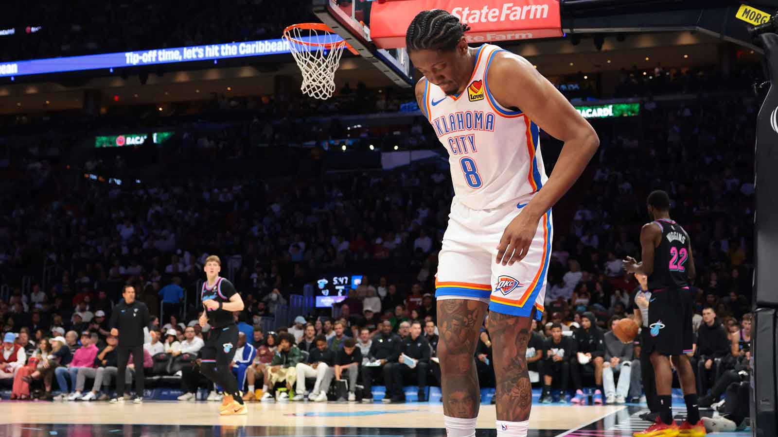 Thunder guard Jalen Williams (8) grabs the back of his right leg after a play against the Miami Heat during the second quarter at Kaseya Center