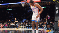 Thunder guard Jalen Williams (8) grabs the back of his right leg after a play against the Miami Heat during the second quarter at Kaseya Center with Thunder coach Mark Daigneault in the background