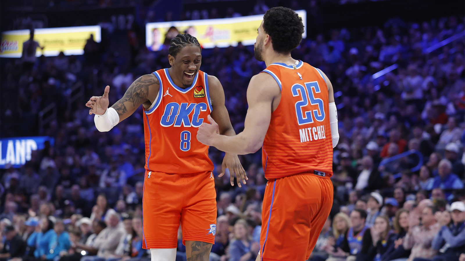 Thunder guard/forward Jalen Williams (8) and guard Ajay Mitchell (25) celebrate after scoring against the Miami Heat during the second half at Paycom Center