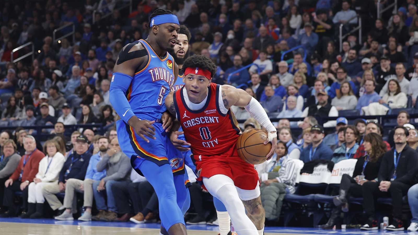 Pelicans guard Jeremiah Fears (0) drives past Oklahoma City Thunder guard Luguentz Dort (5) during the second quarter at Paycom Center
