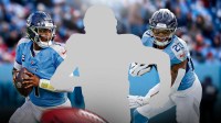 Mystery player in the middle, Cam Ward, Tony Pollard around him, Tennessee Titans wallpaper in the background