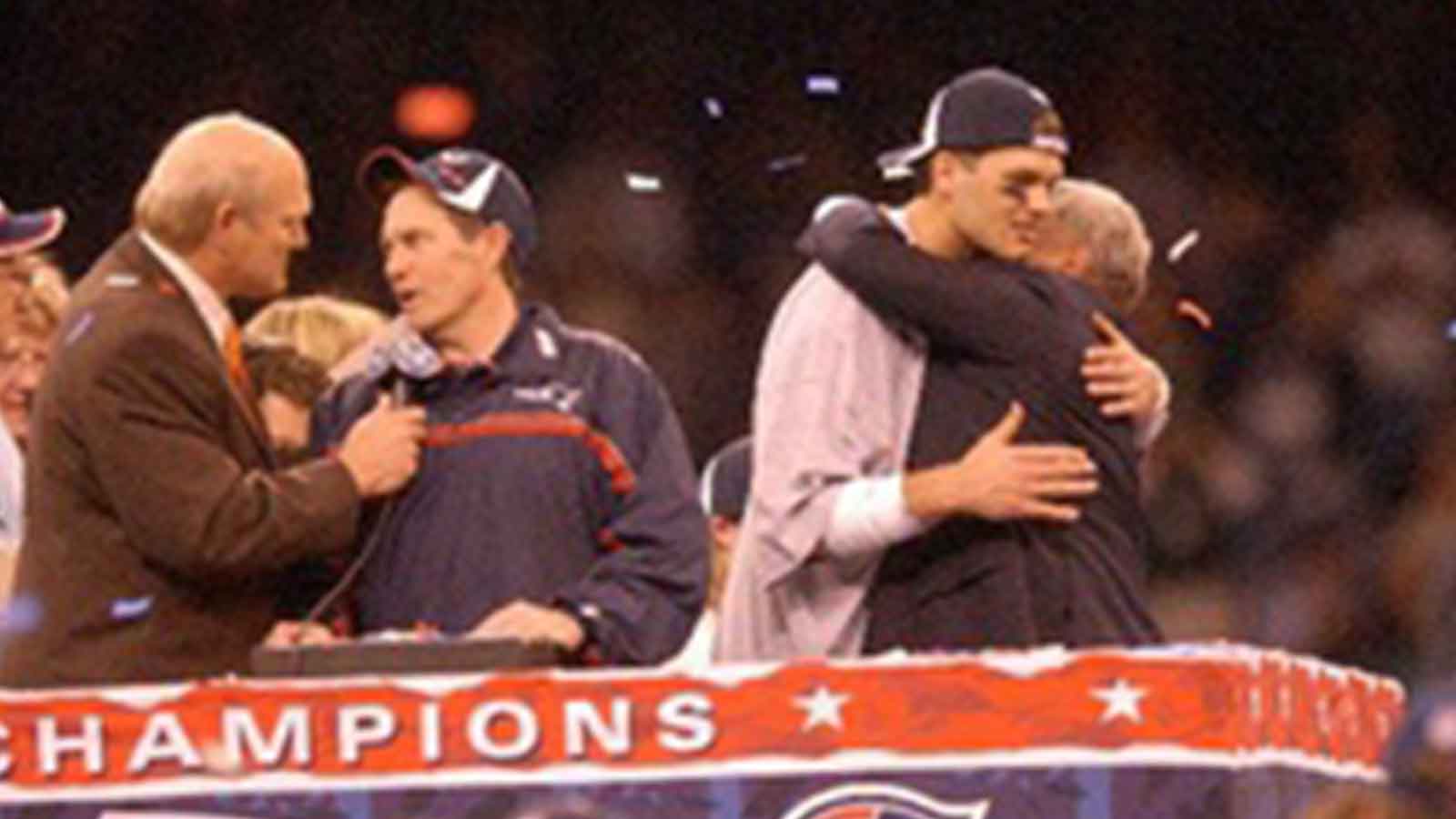 SUPERBOWL SUNDAY in New Orleans, LA. The New England Patriots vs the St. Louis Rams --Coach Bill Belichick talks with Terry Bradshaw as Tom Brady hugs Bob Kraft.