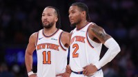 New York Knicks guard Jalen Brunson (11) and New York Knicks guard Miles McBride (2) look on during the second half against the LA Clippers at Madison Square Garden.
