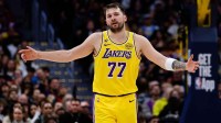 Los Angeles Lakers guard Luka Doncic (77) reacts after a play in the third quarter against the Denver Nuggets at Ball Arena.