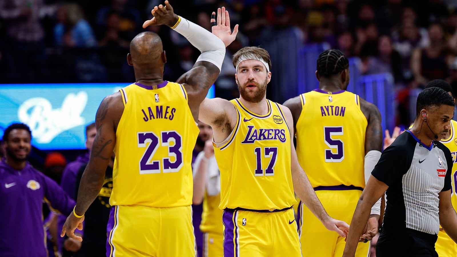 Los Angeles Lakers forward Drew Timme (17) reacts with forward LeBron James (23) in the second quarter against the Denver Nuggets at Ball Arena.