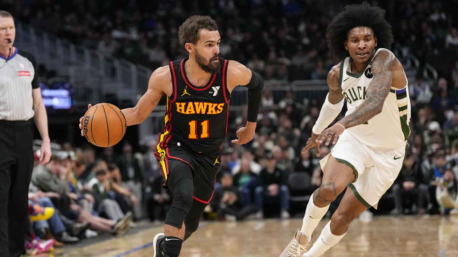 Atlanta Hawks guard Trae Young (11) drives for the basket in front of Milwaukee Bucks guard Kevin Porter Jr. (3) during the fourth quarter at Fiserv Forum.