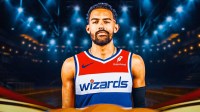 Trae Young smiles in Wizards jersey