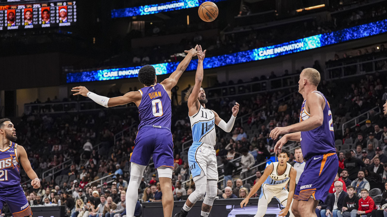 Atlanta Hawks guard Trae Young (11) shoots over Phoenix Suns forward Ryan Dunn (0) during the first half at State Farm Arena.