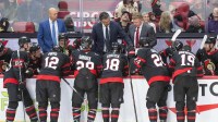 Coaches Travis Green and Daniel Alfredson share a game plan during a timeout in the third period against the New York Islanders at the Canadian Tire Centre.