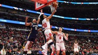 Chicago Bulls guard Tre Jones (30) goes up for a shot against New Orleans Pelicans guard Jeremiah Fears (0) during the first half at United Center.