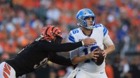 Detroit Lions quarterback Jared Goff (16) is tackled by Cincinnati Bengals defensive end Trey Hendrickson (91) during the fourth quarter at Paycor Stadium.