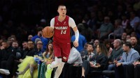 Miami Heat guard Tyler Herro (14) dribbles the basketball against the Phoenix Suns during the first quarter at Kaseya Center.