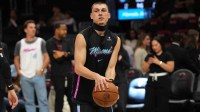 Miami Heat guard Tyler Herro (14) warms-up before the start of the game against the New Orleans Pelicans at Kaseya Center.