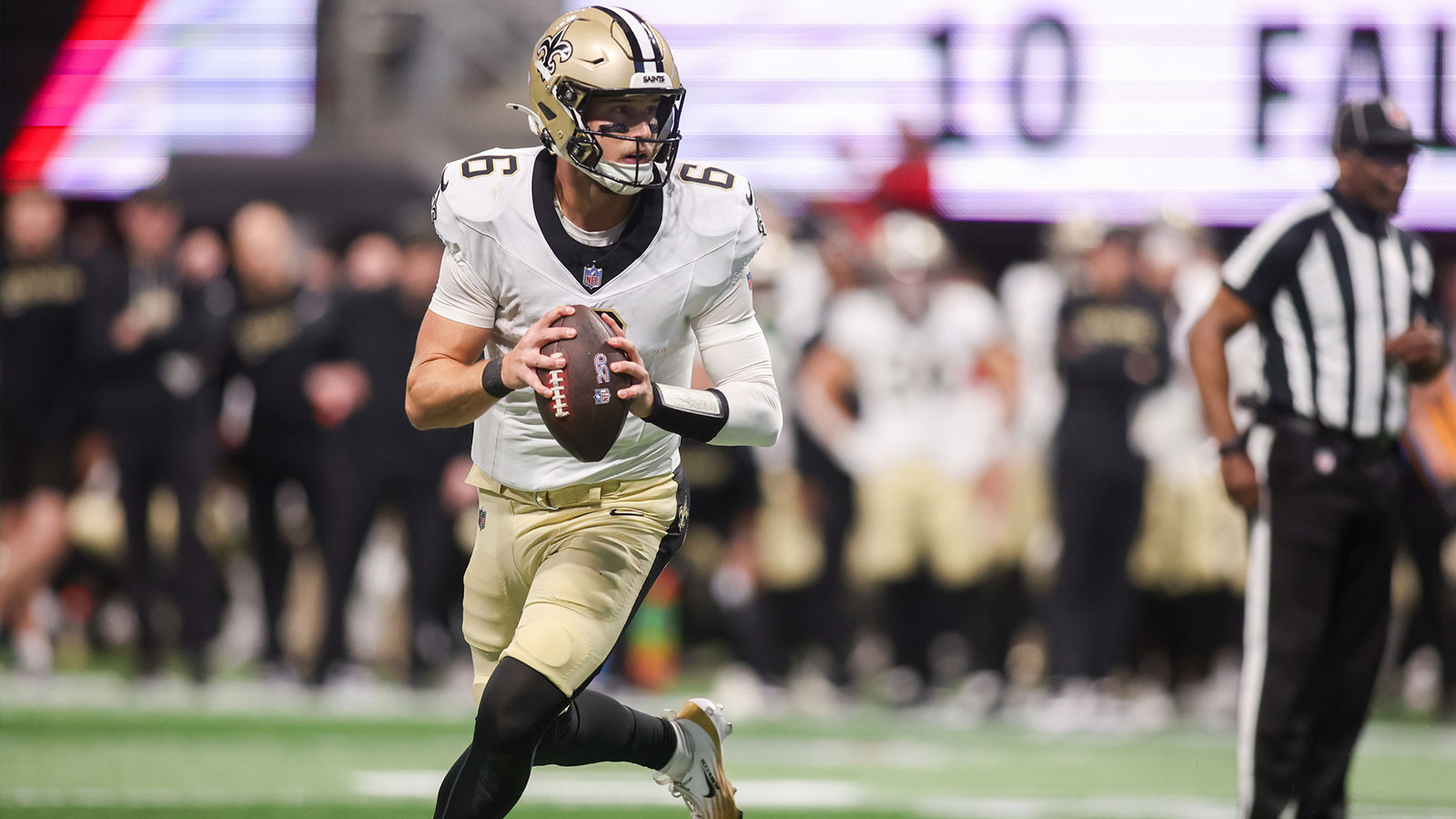 New Orleans Saints quarterback Tyler Shough (6) rolls out against the Atlanta Falcons in the second quarter at Mercedes-Benz Stadium. 