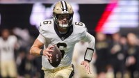 New Orleans Saints quarterback Tyler Shough (6) runs for a touchdown against the Atlanta Falcons in the second quarter at Mercedes-Benz Stadium.