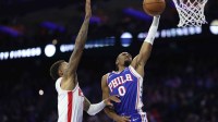 Philadelphia 76ers guard Tyrese Maxey (0) drives for a dunk against Houston Rockets forward Jabari Smith Jr. (10) during the second quarter at Xfinity Mobile Arena.